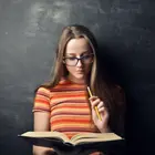 Icon of a person reading a book